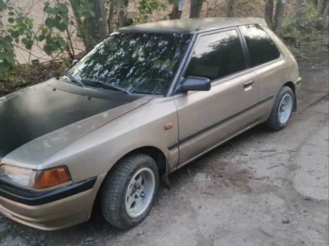 Бежевый Мазда 323, объемом двигателя 1.3 л и пробегом 323 тыс. км за 1500 $, фото 4 на Automoto.ua