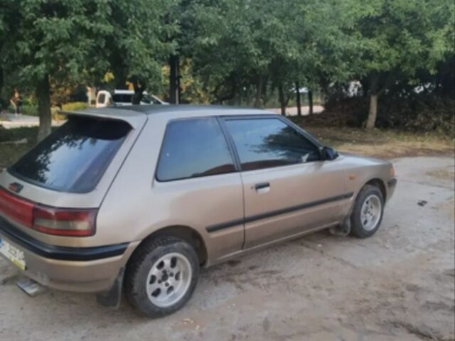 Бежевый Мазда 323, объемом двигателя 1.3 л и пробегом 323 тыс. км за 1500 $, фото 2 на Automoto.ua