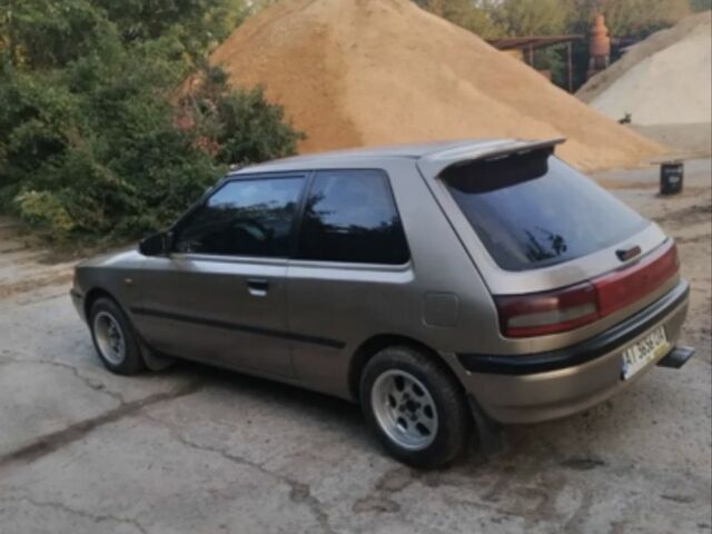 Бежевый Мазда 323, объемом двигателя 1.3 л и пробегом 323 тыс. км за 1500 $, фото 1 на Automoto.ua