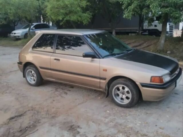 Бежевый Мазда 323, объемом двигателя 1.3 л и пробегом 323 тыс. км за 1500 $, фото 3 на Automoto.ua