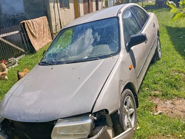 Бежевый Мазда 323, объемом двигателя 1.5 л и пробегом 280 тыс. км за 890 $, фото 2 на Automoto.ua