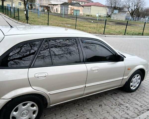 Бежевый Мазда 323, объемом двигателя 2 л и пробегом 210 тыс. км за 2550 $, фото 2 на Automoto.ua