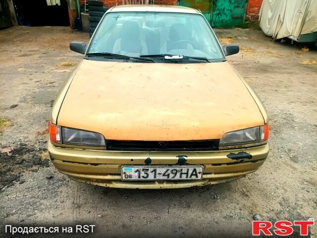 Бежевий Мазда 323, об'ємом двигуна 1.5 л та пробігом 500 тис. км за 740 $, фото 2 на Automoto.ua
