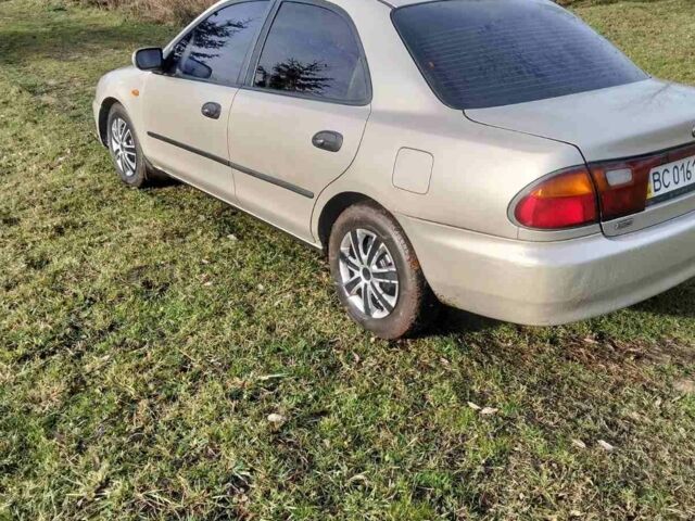 Бежевый Мазда 323, объемом двигателя 1.5 л и пробегом 234 тыс. км за 1500 $, фото 5 на Automoto.ua