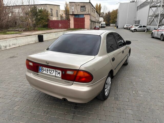 Бежевый Мазда 323, объемом двигателя 1.5 л и пробегом 220 тыс. км за 1500 $, фото 5 на Automoto.ua