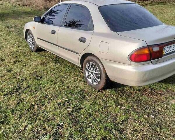 Бежевый Мазда 323, объемом двигателя 1.49 л и пробегом 250 тыс. км за 1350 $, фото 3 на Automoto.ua