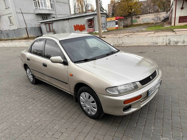 Бежевый Мазда 323, объемом двигателя 1.5 л и пробегом 220 тыс. км за 1500 $, фото 12 на Automoto.ua