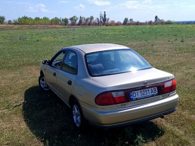 Бежевый Мазда 323, объемом двигателя 1.5 л и пробегом 0 тыс. км за 2333 $, фото 2 на Automoto.ua