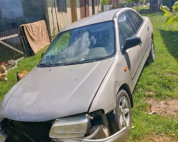 Бежевый Мазда 323, объемом двигателя 1.49 л и пробегом 280 тыс. км за 890 $, фото 3 на Automoto.ua