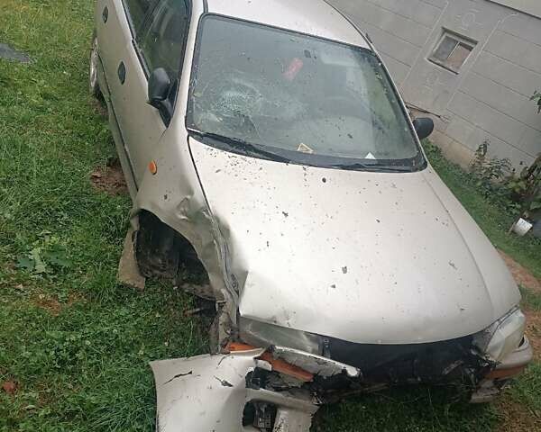 Бежевый Мазда 323, объемом двигателя 1.49 л и пробегом 280 тыс. км за 890 $, фото 1 на Automoto.ua