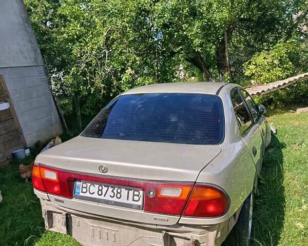 Бежевый Мазда 323, объемом двигателя 1.49 л и пробегом 280 тыс. км за 890 $, фото 5 на Automoto.ua