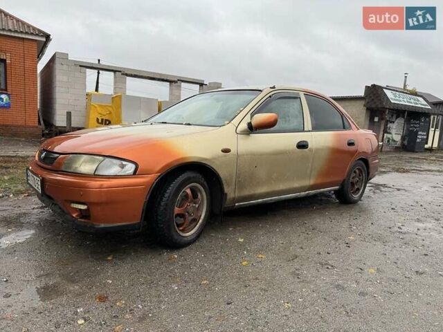 Бежевий Мазда 323, об'ємом двигуна 1.5 л та пробігом 300 тис. км за 1500 $, фото 1 на Automoto.ua