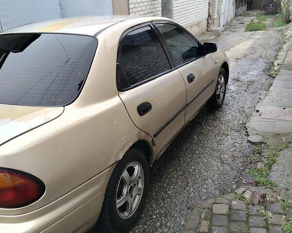 Бежевый Мазда 323, объемом двигателя 1.5 л и пробегом 334 тыс. км за 1200 $, фото 6 на Automoto.ua