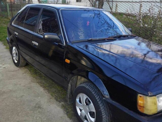 Чорний Мазда 323, об'ємом двигуна 1.5 л та пробігом 249 тис. км за 750 $, фото 1 на Automoto.ua