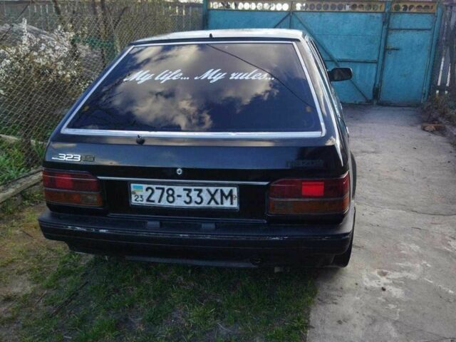 Чорний Мазда 323, об'ємом двигуна 1.5 л та пробігом 249 тис. км за 750 $, фото 2 на Automoto.ua