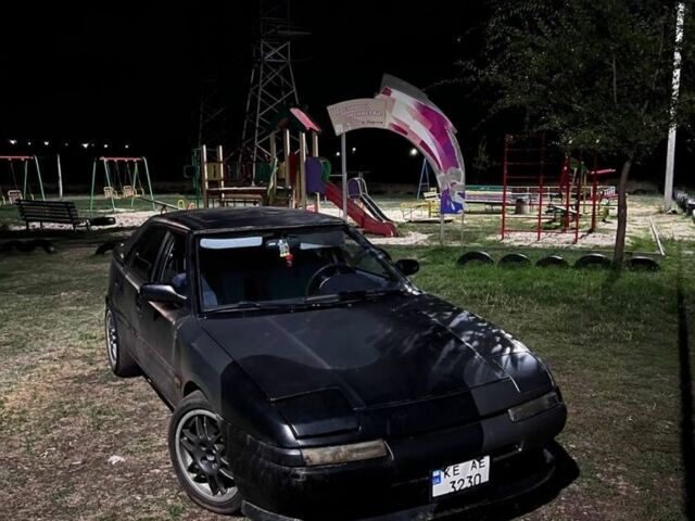 Черный Мазда 323, объемом двигателя 1.8 л и пробегом 777 тыс. км за 761 $, фото 2 на Automoto.ua