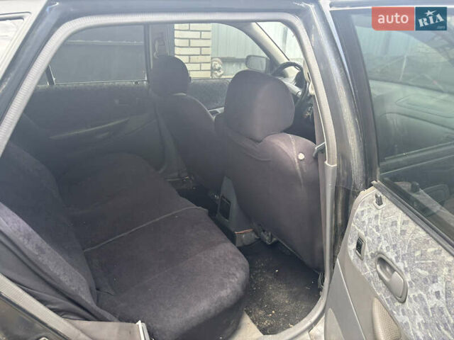 Мазда 323 1999 в Тульчине на Automoto.ua Черный Мазда 323, объемом двигателя 1.5 л и пробегом 247 тыс. км за 2150 $, фото 7 на Automoto.ua