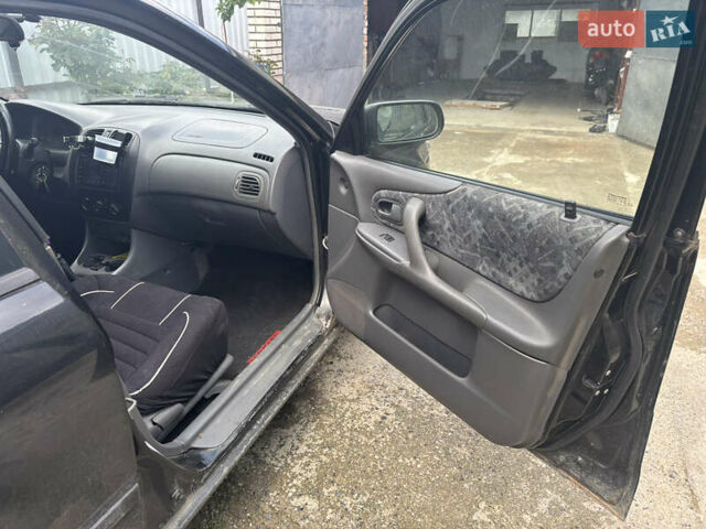 Мазда 323 1999 в Тульчине на Automoto.ua Черный Мазда 323, объемом двигателя 1.5 л и пробегом 247 тыс. км за 2150 $, фото 9 на Automoto.ua