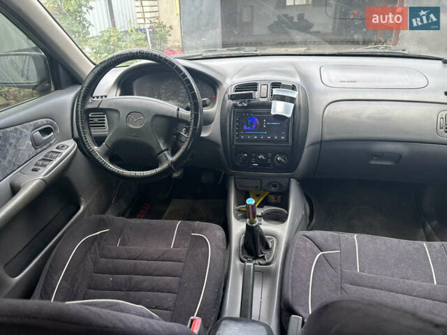 Мазда 323 1999 в Тульчине на Automoto.ua Черный Мазда 323, объемом двигателя 1.5 л и пробегом 247 тыс. км за 2150 $, фото 4 на Automoto.ua