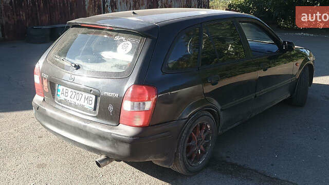 Черный Мазда 323, объемом двигателя 1.5 л и пробегом 247 тыс. км за 1900 $, фото 4 на Automoto.ua