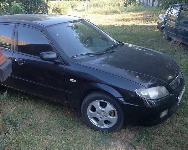 Чорний Мазда 323, об'ємом двигуна 1.6 л та пробігом 255 тис. км за 1900 $, фото 2 на Automoto.ua