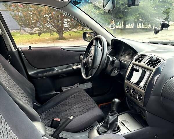 Черный Мазда 323, объемом двигателя 2 л и пробегом 286 тыс. км за 3200 $, фото 7 на Automoto.ua