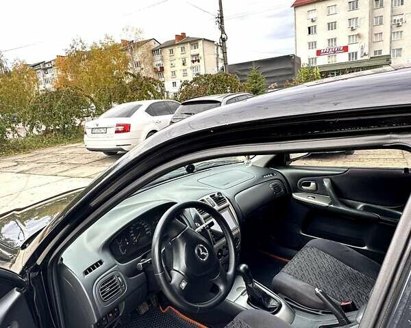 Черный Мазда 323, объемом двигателя 2 л и пробегом 286 тыс. км за 3200 $, фото 5 на Automoto.ua