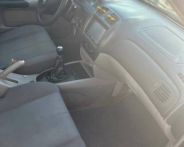 Черный Мазда 323, объемом двигателя 1.6 л и пробегом 250 тыс. км за 2500 $, фото 1 на Automoto.ua