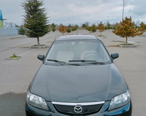 Черный Мазда 323, объемом двигателя 1.6 л и пробегом 305 тыс. км за 3800 $, фото 13 на Automoto.ua