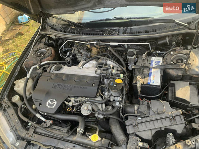 Черный Мазда 323, объемом двигателя 2 л и пробегом 320 тыс. км за 2700 $, фото 8 на Automoto.ua
