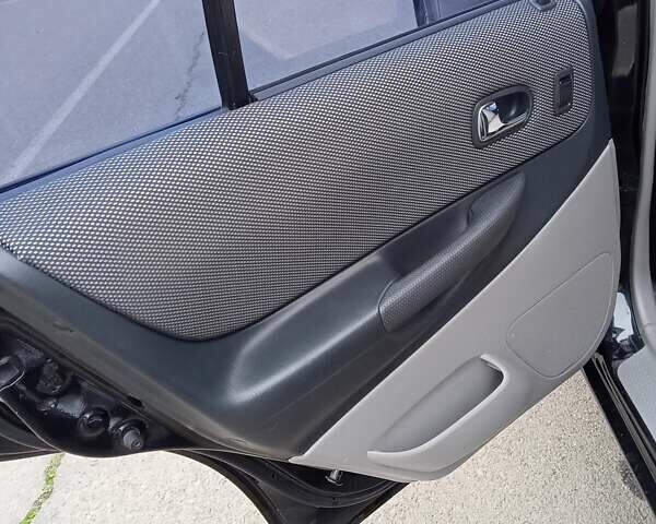 Черный Мазда 323, объемом двигателя 1.6 л и пробегом 305 тыс. км за 3800 $, фото 56 на Automoto.ua