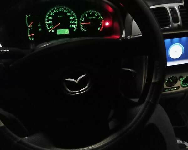 Черный Мазда 323, объемом двигателя 1.6 л и пробегом 305 тыс. км за 3800 $, фото 14 на Automoto.ua