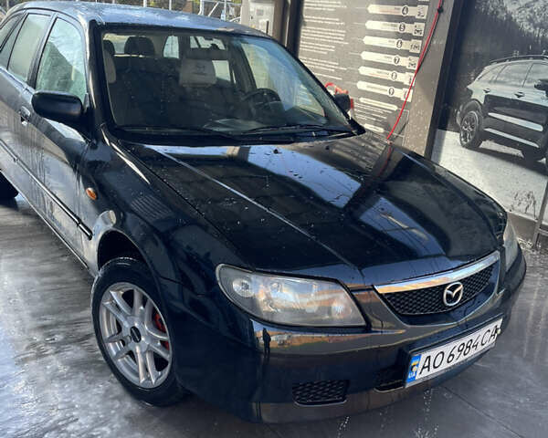 Черный Мазда 323, объемом двигателя 2 л и пробегом 320 тыс. км за 2700 $, фото 3 на Automoto.ua