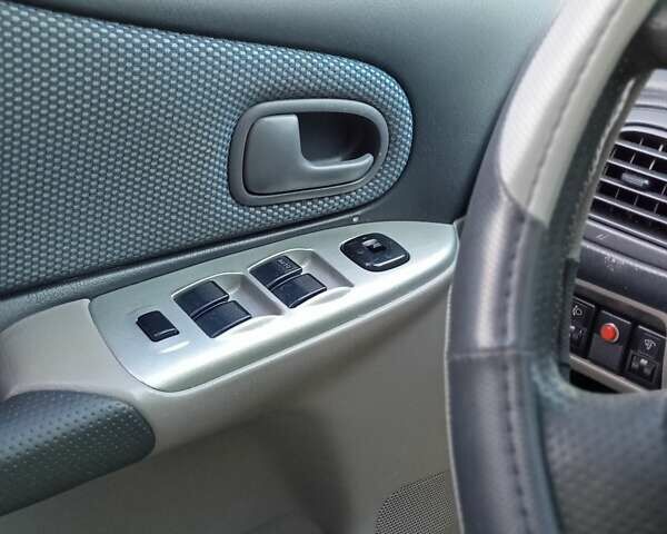 Черный Мазда 323, объемом двигателя 1.6 л и пробегом 305 тыс. км за 3800 $, фото 61 на Automoto.ua