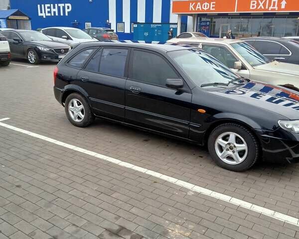 Черный Мазда 323, объемом двигателя 1.6 л и пробегом 305 тыс. км за 3800 $, фото 8 на Automoto.ua