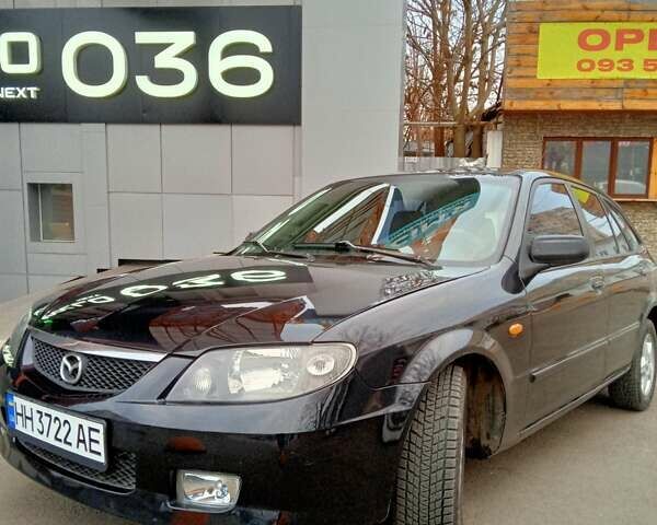 Черный Мазда 323, объемом двигателя 1.6 л и пробегом 305 тыс. км за 3800 $, фото 2 на Automoto.ua