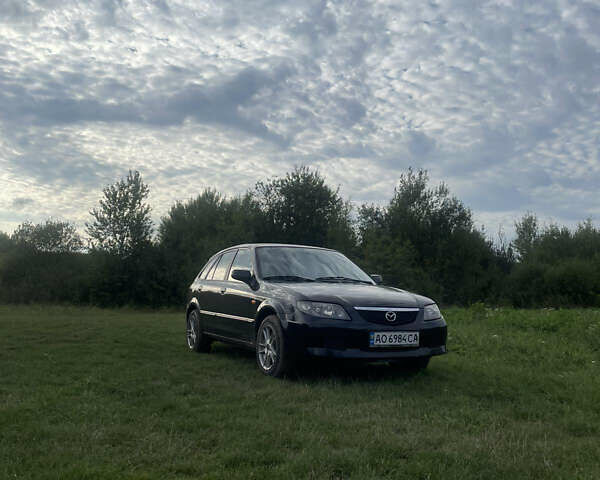 Черный Мазда 323, объемом двигателя 2 л и пробегом 320 тыс. км за 2700 $, фото 1 на Automoto.ua