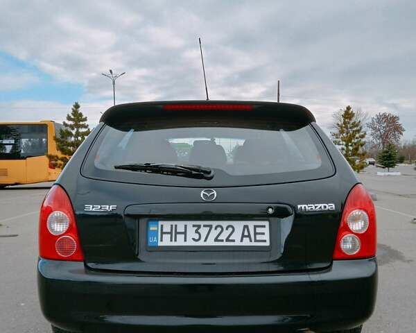 Черный Мазда 323, объемом двигателя 1.6 л и пробегом 305 тыс. км за 3800 $, фото 11 на Automoto.ua