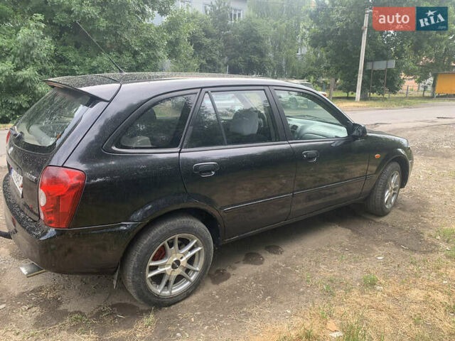 Черный Мазда 323, объемом двигателя 2 л и пробегом 320 тыс. км за 2700 $, фото 4 на Automoto.ua