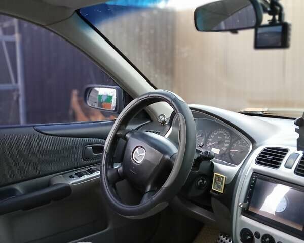 Черный Мазда 323, объемом двигателя 1.6 л и пробегом 305 тыс. км за 3800 $, фото 64 на Automoto.ua