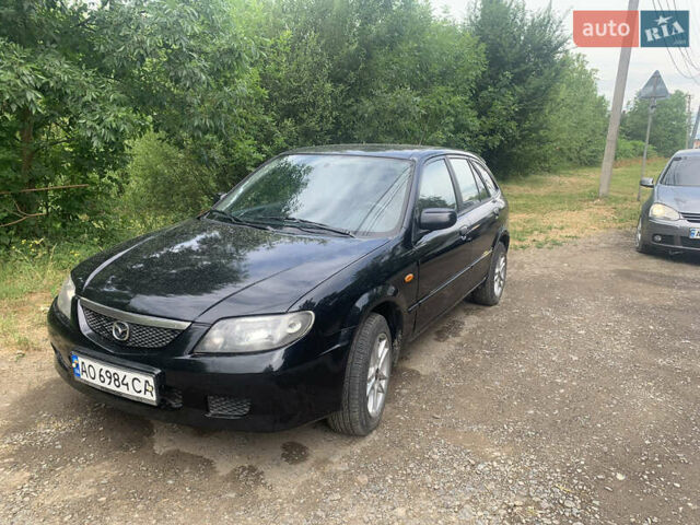 Черный Мазда 323, объемом двигателя 2 л и пробегом 320 тыс. км за 2700 $, фото 5 на Automoto.ua