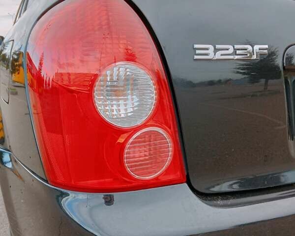 Черный Мазда 323, объемом двигателя 1.6 л и пробегом 305 тыс. км за 3800 $, фото 37 на Automoto.ua