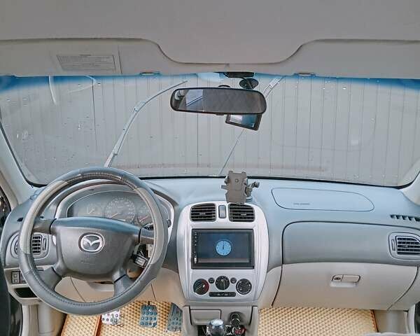 Черный Мазда 323, объемом двигателя 1.6 л и пробегом 305 тыс. км за 3800 $, фото 23 на Automoto.ua