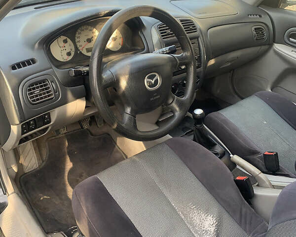 Черный Мазда 323, объемом двигателя 2 л и пробегом 320 тыс. км за 2700 $, фото 6 на Automoto.ua
