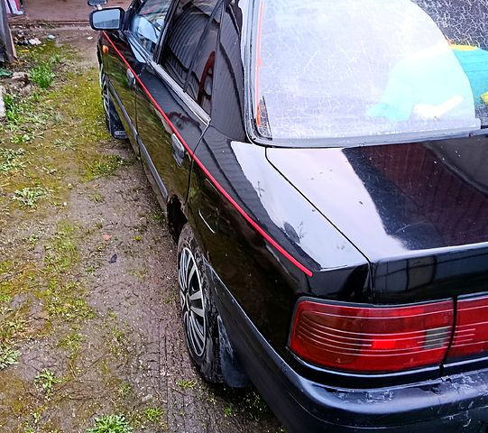 Черный Мазда 323, объемом двигателя 1.7 л и пробегом 300 тыс. км за 700 $, фото 12 на Automoto.ua