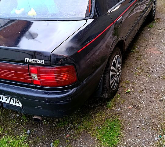 Черный Мазда 323, объемом двигателя 1.7 л и пробегом 300 тыс. км за 700 $, фото 13 на Automoto.ua