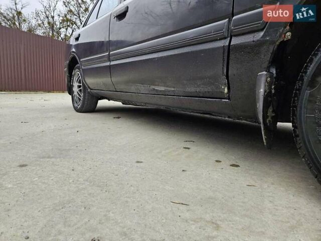 Чорний Мазда 323, об'ємом двигуна 1.5 л та пробігом 450 тис. км за 1200 $, фото 16 на Automoto.ua