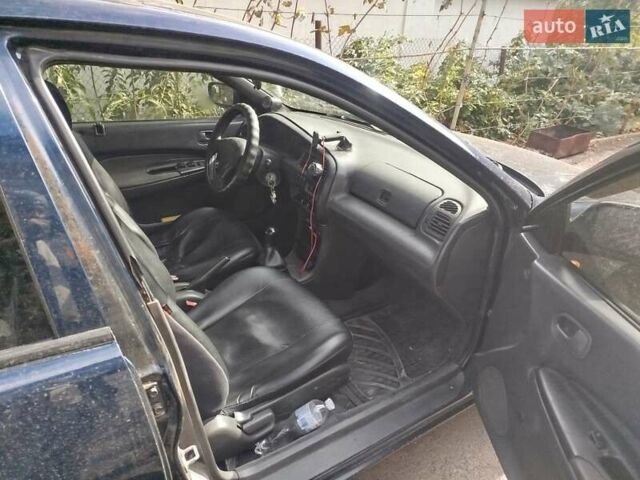 Черный Мазда 323, объемом двигателя 1.49 л и пробегом 319 тыс. км за 2400 $, фото 5 на Automoto.ua