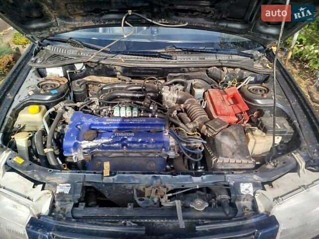 Черный Мазда 323, объемом двигателя 1.49 л и пробегом 319 тыс. км за 2400 $, фото 6 на Automoto.ua