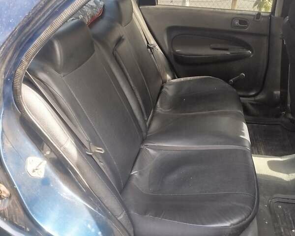 Черный Мазда 323, объемом двигателя 1.49 л и пробегом 319 тыс. км за 2400 $, фото 4 на Automoto.ua